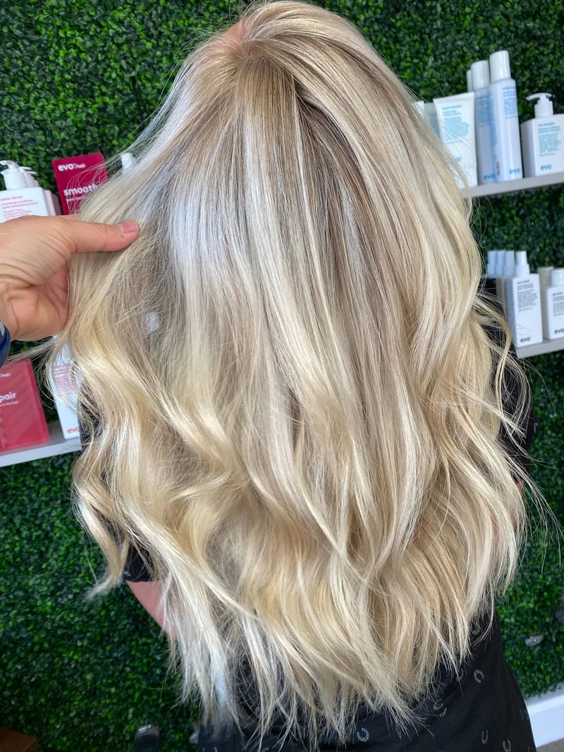 Bright icy platinum blonde full highlight with soft waves, by Stone Fox Salon in Meridian, Idaho
